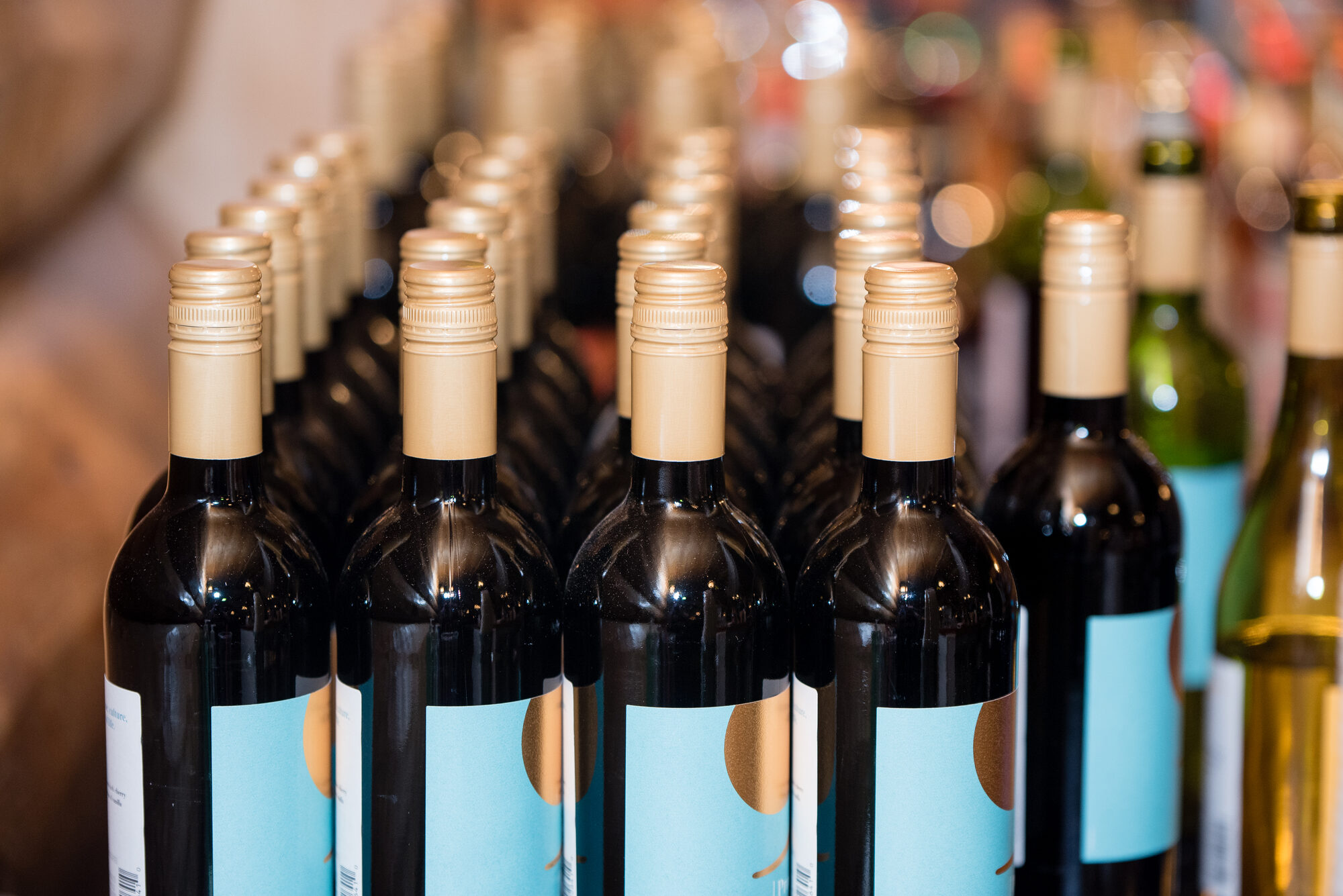 Rows of wine bottles lined up at the bar