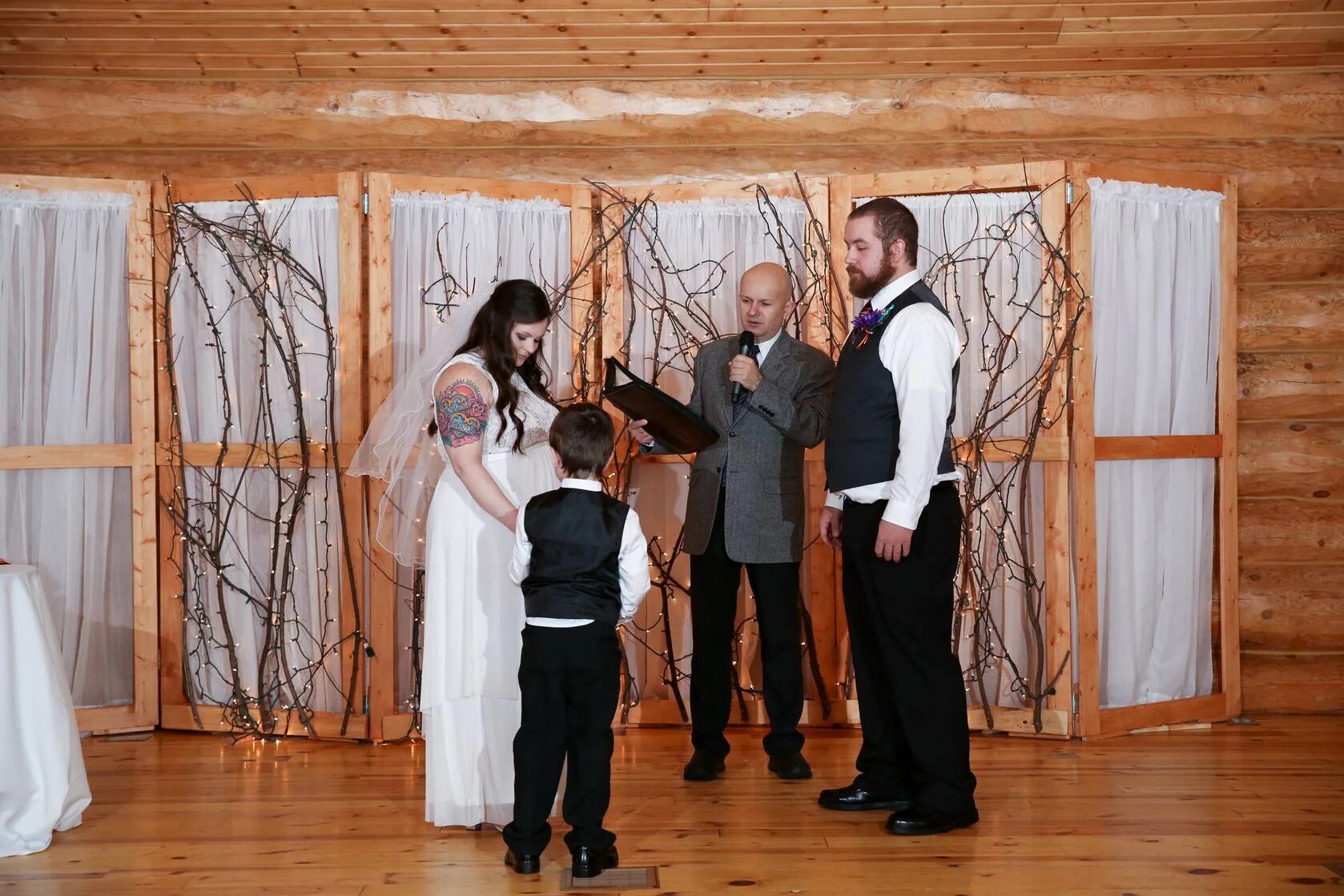 Rev. George Maverick with a couple on their wedding day