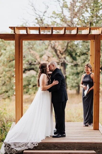 Rev. Vicky Carlson leading a wedding ceremony
