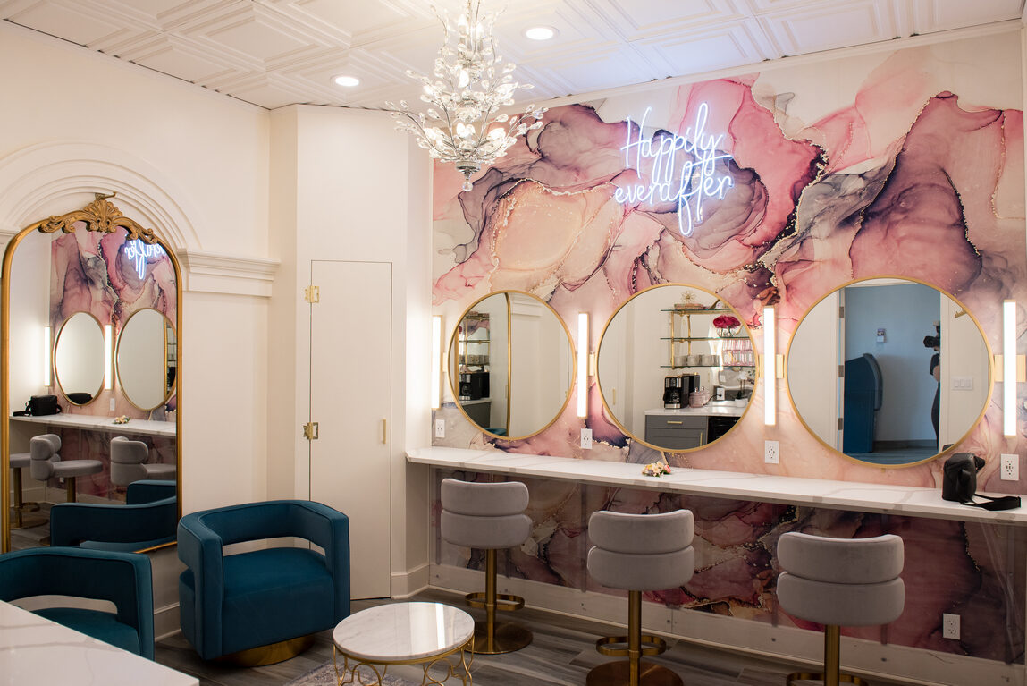 The Royal Cliff Bride's Salon with round gold mirrors, a crystal chandelier, and a 'Happily ever after' neon sign